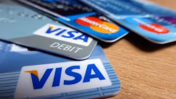Close-up of Visa and Mastercard debit cards