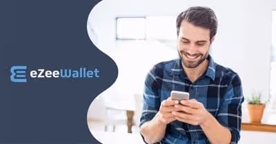 Man using smartphone with eZeeWallet logo