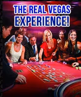 Diverse group around red roulette table enjoying the real Vegas casino experience
